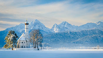 St. Coloman church and Alps in Bavaria during winter