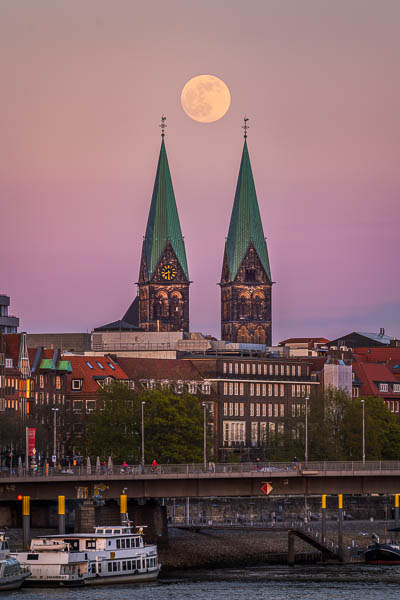 Full moon above the cathedral towers in Bremen, Germany by Michael Abid