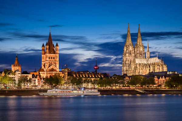 Old town and cathedral at night in Cologne, Germany by Michael Abid