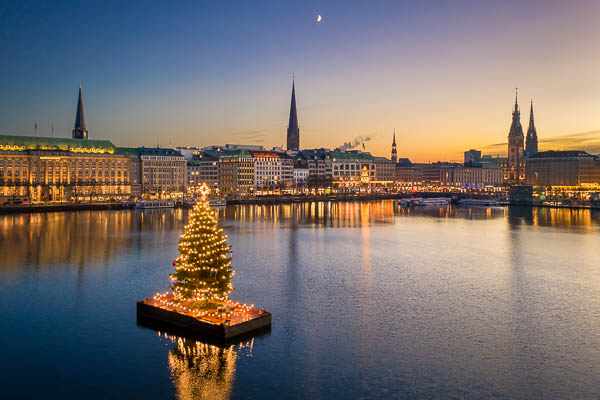 Sunset skyline of Hamburg, Germany with Christmas tree on the Binnenalster lake by Michael Abid