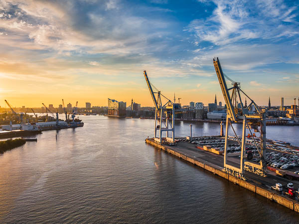 Container terminal in the port of Hamburg, Germany with Elbphilharmonie in the background by Michael Abid