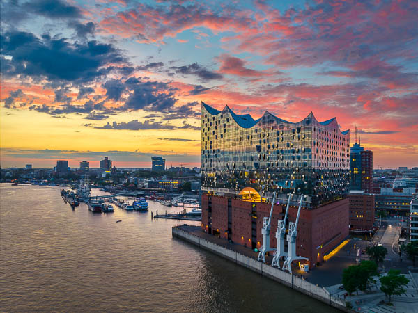 Elbphilharmonie building in Hamburg, Germany during a colorful sunset by Michael Abid