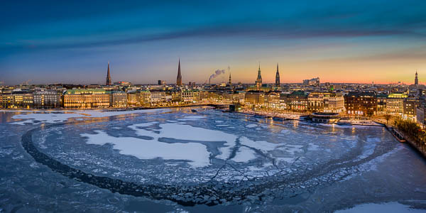 Winter sunset skyline of Hamburg, Germany with frozen Binnenalster lake by Michael Abid