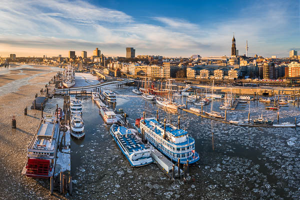 Rare view of the floating ice on the Elbe river in the harbor of Hamburg, Germany with the skyline of the city in the background by Michael Abid