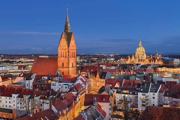 Aerial view of the old town of Hannover, Germany at night with Marktkirche in the foreground and Town Hall in the background by Michael Abid