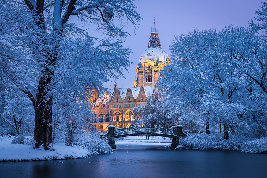 Town Hall of Hannover, Germany covered in snow during winter by Michael Abid