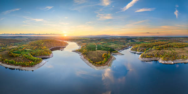 View from the Rotestein in Germany's Harz region, looking across the Rappbode Reservoir toward the Wurmberg and Brocken mountains in the background, taken at sunset by Michael Abid