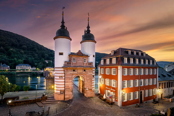 Gate to the old bridge in Heidelberg, Germany at sunrise by Michael Abid