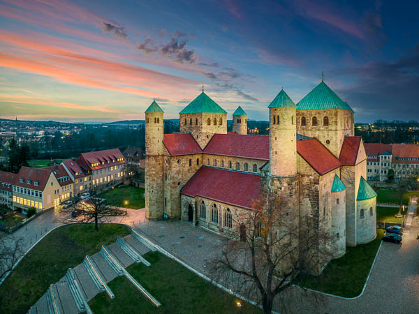 Aerial view of the Michaeliskirche church in Hildesheim, Germany during sunset by Michael Abid