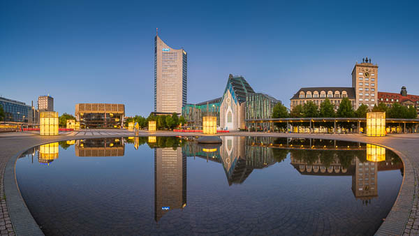 Panorama of Augustusplatz in Leipzig at night, featuring the City-Hochhaus, University Church and Krochhochhaus, reflected in the fountain, Saxony, Germany by Michael Abid