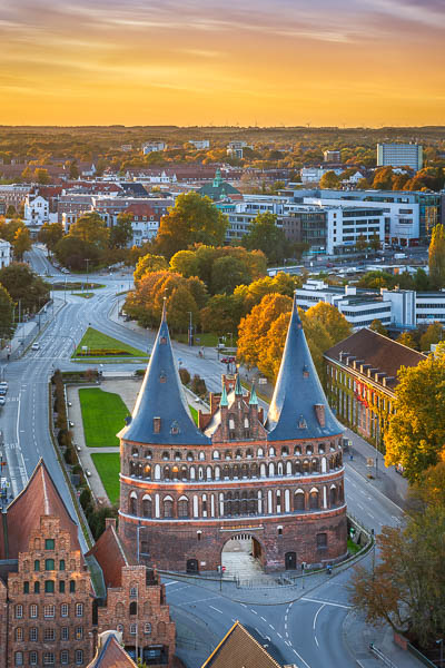 Autumn sunset at the Holstentor in Lübeck, Germany by Michael Abid