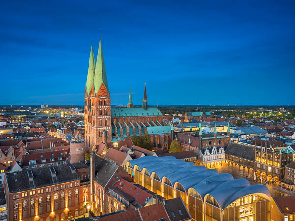 Marienkirche and the market square of Lübeck, Germany by night by Michael Abid