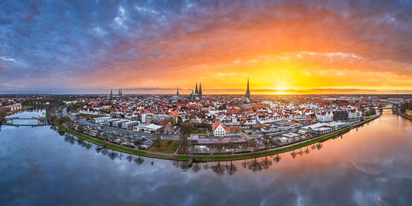 Panorama of the famous seven church towers of Lübeck, Germany at sunset by Michael Abid