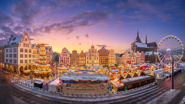 Panorama of the Christmas market on the Neuer Markt square in Rostock, Germany by Michael Abid