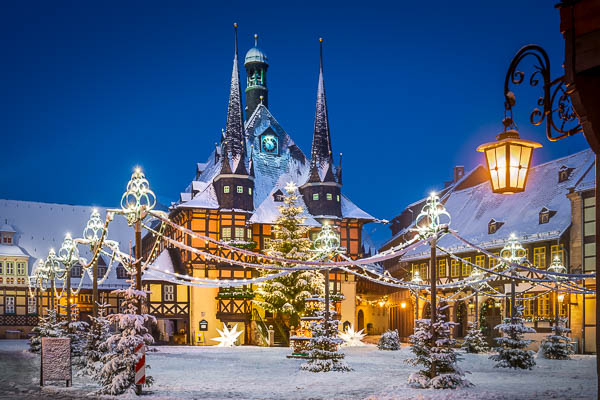Town Hall of Wernigerode, Germany during winter with snow and Christmas decorations by Michael Abid