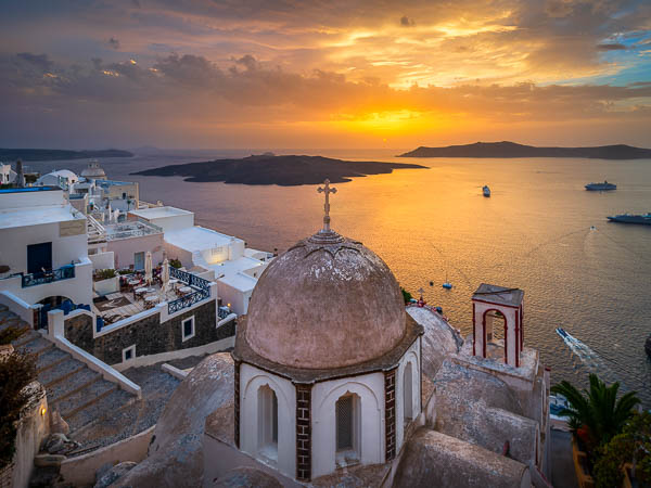Old church in Fira on the Santorini island, Greece during sunset by Michael Abid