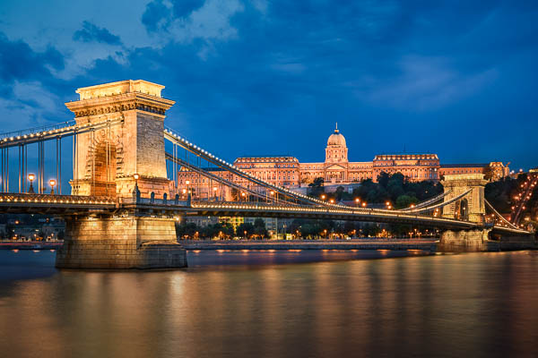 Buda Castle and Chain Bridge at night in Budapest, Hungary by Michael Abid