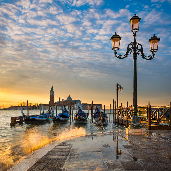 Gondolas on the Grand Canal in Venice, Italy at sunrise by Michael Abid