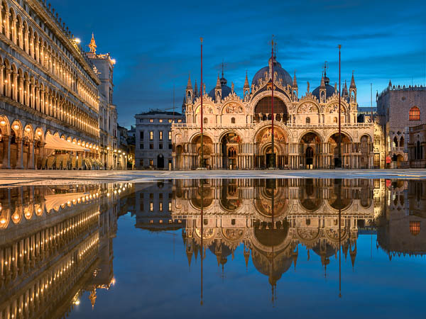 Piazza San Marco in Venice, Italy at night during Acqua Alta flooding by Michael Abid