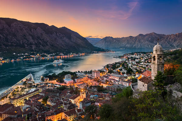 Sun setting behind the mountains of the Bay of Kotor, Montenegro by Michael Abid