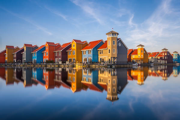 Colorful buildings along the water in Reitdiephaven, Groningen, Netherlands by Michael Abid
