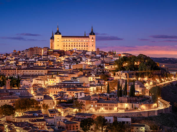 Alcazar and historic town of Toledo, Spain at night by Michael Abid